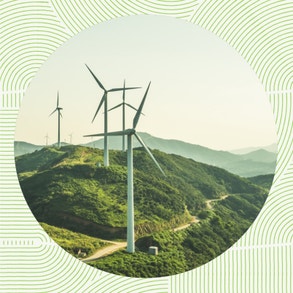 a windmill farm that creates sustainable energy on a hill